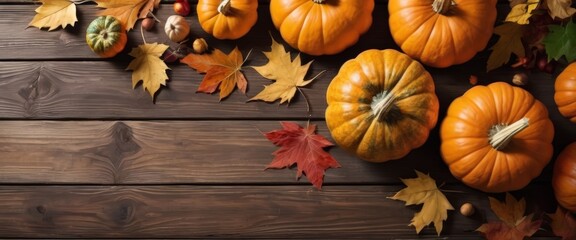 autumn background with pumpkin elements on a wooden board. Autumn Thanksgiving background. Pumpkins, acorns and leaves on wooden board