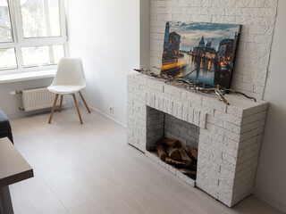studio in minimalist style, fireplace, sofa