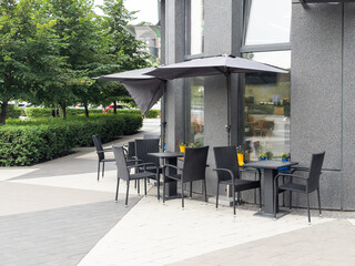 Close up of an empty table with empty chairs at a local outdoor resturant. 