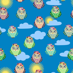 Seamless colorful owl pattern for children with flowers, clouds, branches