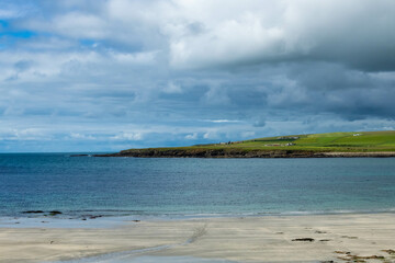 Scotland sea shore on a sunny day on a trip from Kirkwall