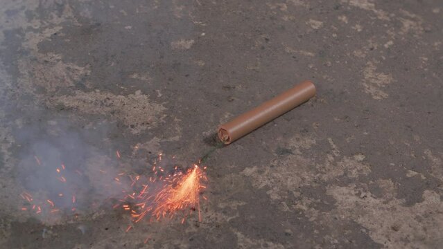 Dynamite Cartridge Rolls On Concrete