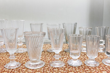 A set of vintage shot glasses for Russian vodka is on a table, close up
