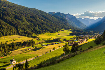 Obraz premium Mountain valley during sunset. Gschnitztal valley near the village of Trins, Tyrol, Austrian Alps, Austria.