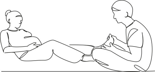 husband massages feet of pregnant wife