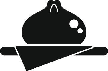 Black silhouette of a steamed bun lying on a napkin, traditional chinese food