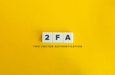 Two-Factor Authentication (2FA). An extra layer of security to accounts. Text on Block Letter Tiles on Flat Background. Minimalist Aesthetics.