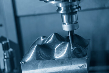 The CNC milling machine rough cutting the injection mold parts by indexable tools.