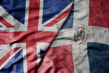 big waving colorful flag of dominican republic and national flag of great britain on the dollar...