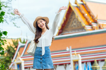 Asian chinese look tourist enjoying herself in front The Grand Palace, Bangkok, Thailand