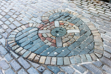 Edinburgh, Scotland. The Heart of Midlothian, a mosaic located in the Royal Mile that marks the location of the entrance to the Old Tolbooth