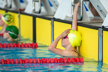 Girl swimmer at the finish of a swimming race