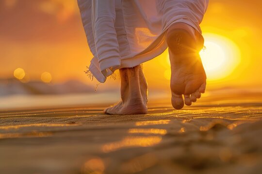 Close up low angle view of Jesus feet walking on sand