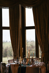 table setting at a wedding with candles 