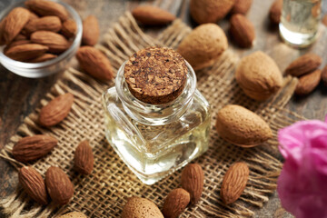 Almond oil in a glass bottle - natural ingredient for cosmetics