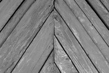 Old green wooden fence, abstract background. Black and white photo