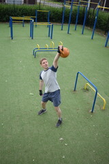 A young man in sportswear engages in a workout, using a sport tool for physical exercises on a...