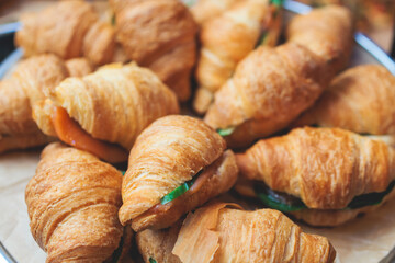 Set of coffee break in the hotel during conference meeting, with tea and coffee catering, decorated catering banquet table with variety of different pastry and bakery, with croissants cookies