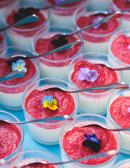 Beautiful multicolored decorated baked sweet tasty candy bar dessert selection with cake, pie and pastries selection, catering banquet table on kids children party, coffee break buffet at a conference