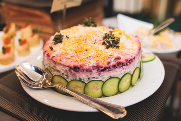 Beautifully decorated luxury banquet catering table, with variety of with different food snacks appetizers on corporate birthday party event wedding celebration, canape, salad, delicatessen variety