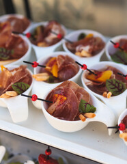 Beautifully decorated luxury banquet catering table, with variety of with different food snacks appetizers on corporate birthday party event wedding celebration, canape, salad, delicatessen variety