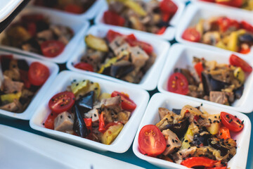 Beautifully decorated luxury banquet catering table, with variety of with different food snacks appetizers on corporate birthday party event wedding celebration, canape, salad, delicatessen variety