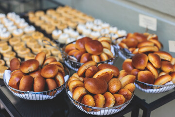 Beautifully decorated luxury banquet catering table, with variety of with different food snacks appetizers on corporate birthday party event wedding celebration, canape, salad, delicatessen variety