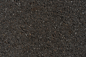 Close-up of textured asphalt road surface