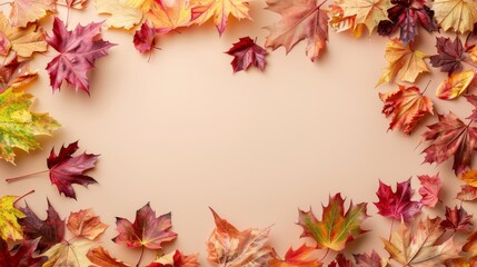 Autumn frame with colorful maple leaves on a beige background. Perfect for seasonal designs.