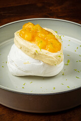 Meringue Pavlova cake with  mango