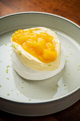 Meringue Pavlova cake with  mango