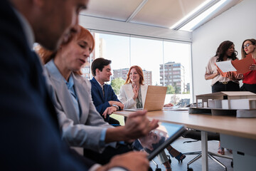 Group of workers from an architecture company improving resources for their business