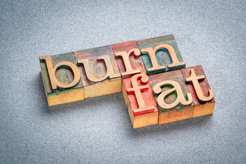 burn fat - text in retro letterpress wood type, metabolism, health and lifestyle concept