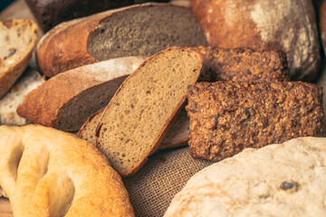 Various types of bread on canvas fabric. Assorted bread.