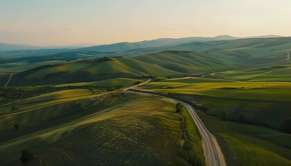 Winding road, top view of beautiful aerial view of asphalt road, highway through forest and fields