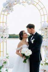 wedding ceremony of the newlyweds on the pier