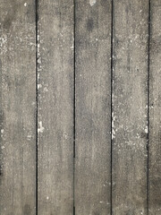 The wooden floor looks dirty and not clean.