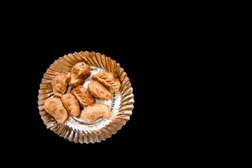 Golden Fried Momos on Black backdrop