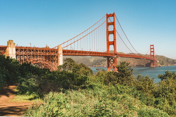 Nature and engineering collide in a picturesque view of the famous Golden Gate bridge.