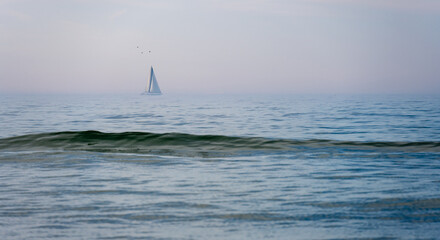 sailboat on wavy Baltic sea on Hel peninsula in Poland