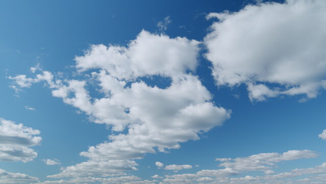 Blue heaven summer cloudscape. Rolling puffy white clouds are moving. Timelapse.