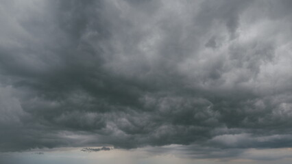 Beautiful dark dramatic sky with stormy clouds before rain or snow. Thunderstorm heaven landscape....