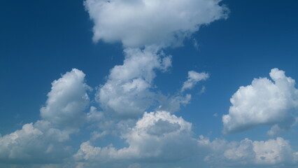 Summer clouds float across blue sky. Blue sky white clouds. Timelapse.