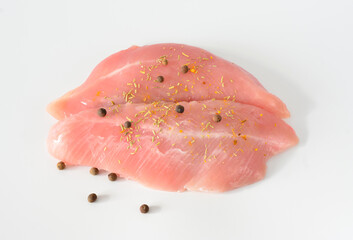chicken fillet with allspices on white cut out  