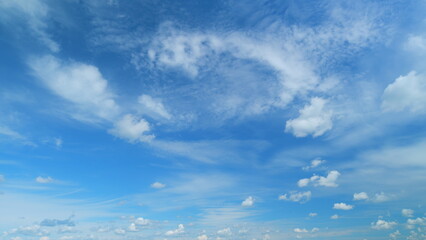 Blue heaven summer cloudscape. Rolling puffy white layered clouds are moving. Timelapse.