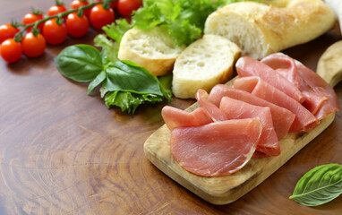 smoked ham of pork on a wooden board