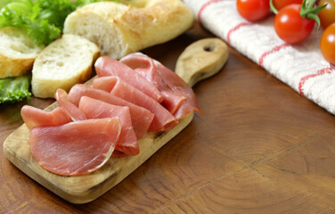 smoked ham of pork on a wooden board