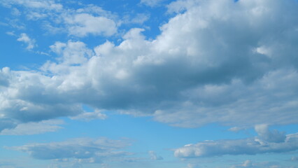 Fluffy clouds sky atmosphere. Puffy fluffy white clouds. Cloud sky scape. Time lapse.