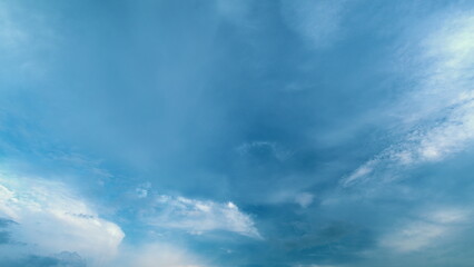 Fototapeta premium Beautiful Sunny Pastel Blue Sky In Tropical Summer. Blue Sky And Clouds Moving In Opposite Direction Natural Background.