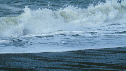 Beautiful Strong Big Waves With Foam During A Summer Storm On Sea. Beautiful Sea Water Spray Splash. Slow motion.